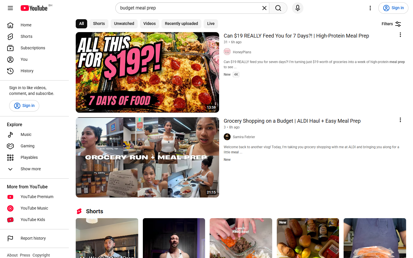 Signed-out YouTube search results for budget meal prep, with the Shorts tab and a Shorts row visible