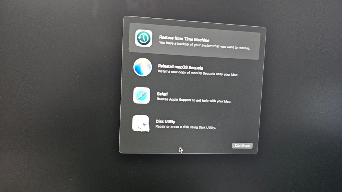macOS Recovery Mode screen showing four options Restore Time Machine Reinstall macOS Sequoia Safari Disk Utility
